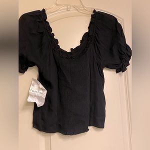 Women’s black flirty top